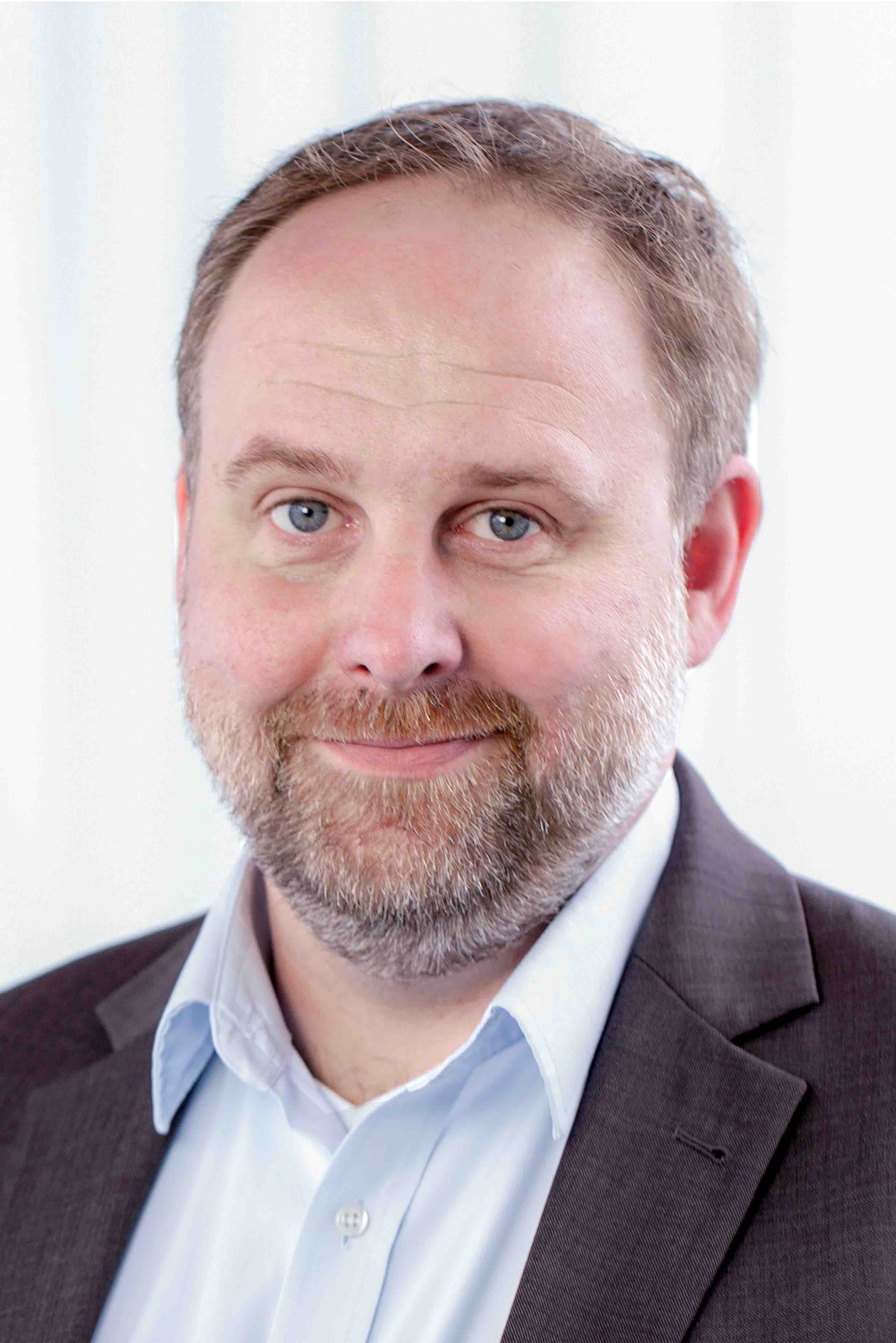 man, beard, blue eyes, brown suit, white shirt